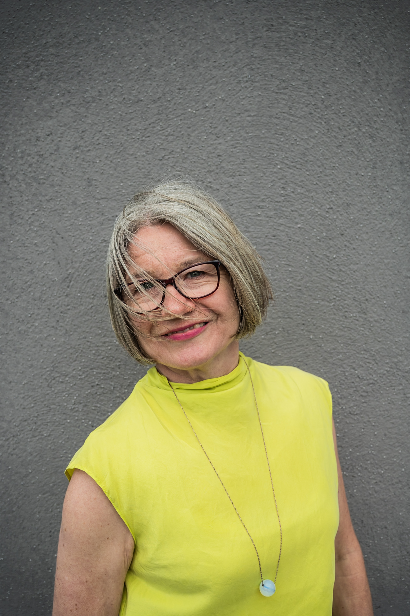 Portrait against a grey wall, UK