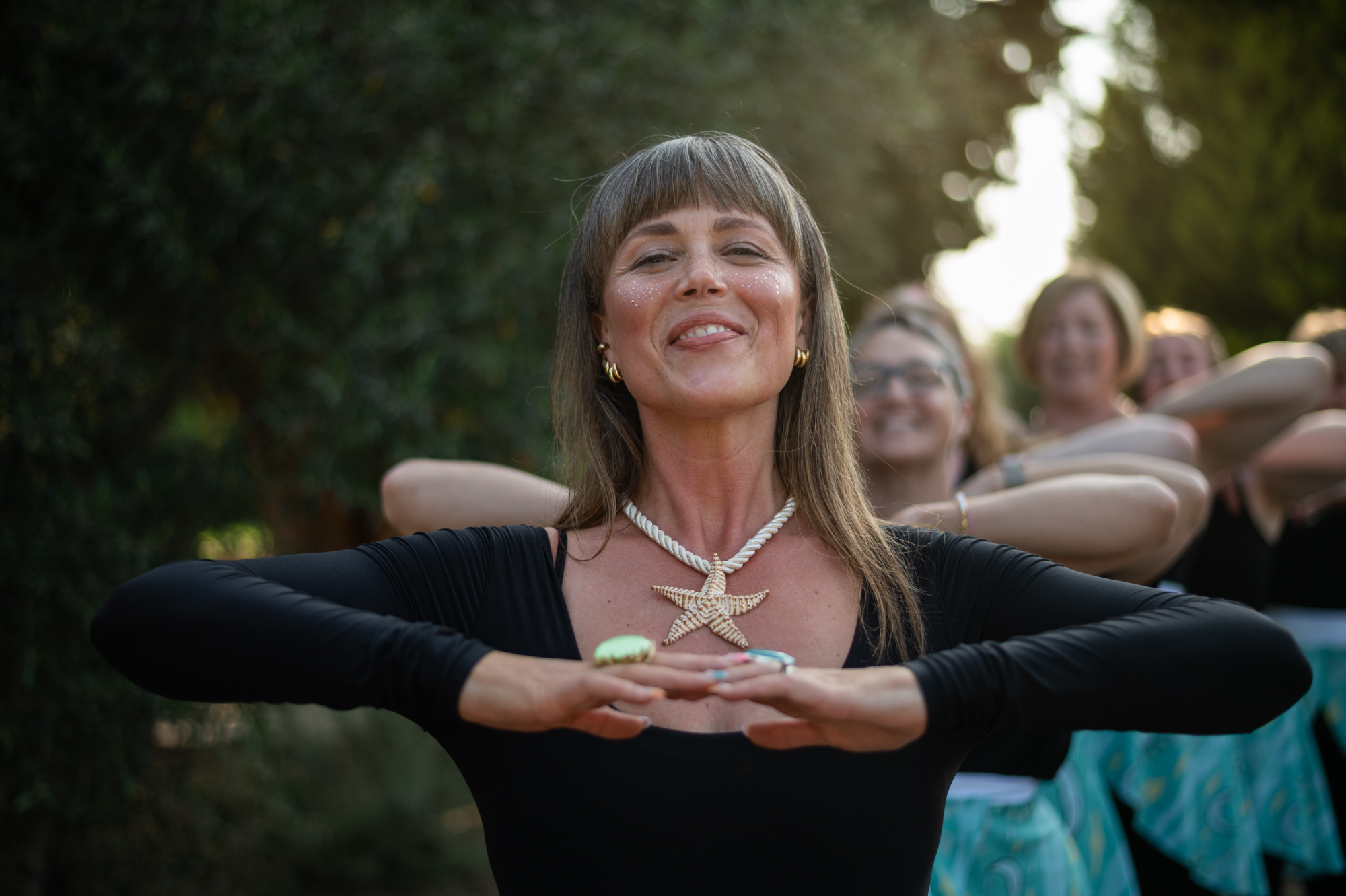A joyful group moment in an olive grove, Crete